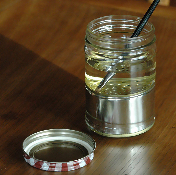 cleaning a paintbrush with paint thinner