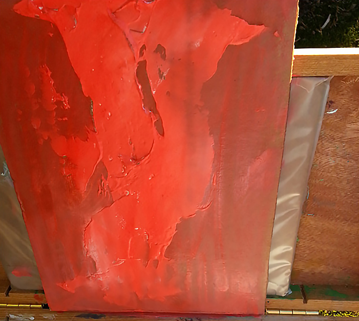 Warm underpainting of red to prepare canvas