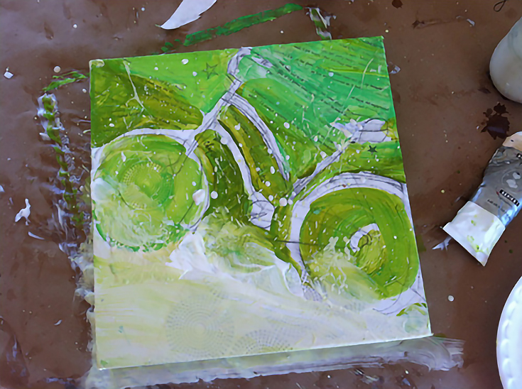 Blending green paint onto bicycle composition