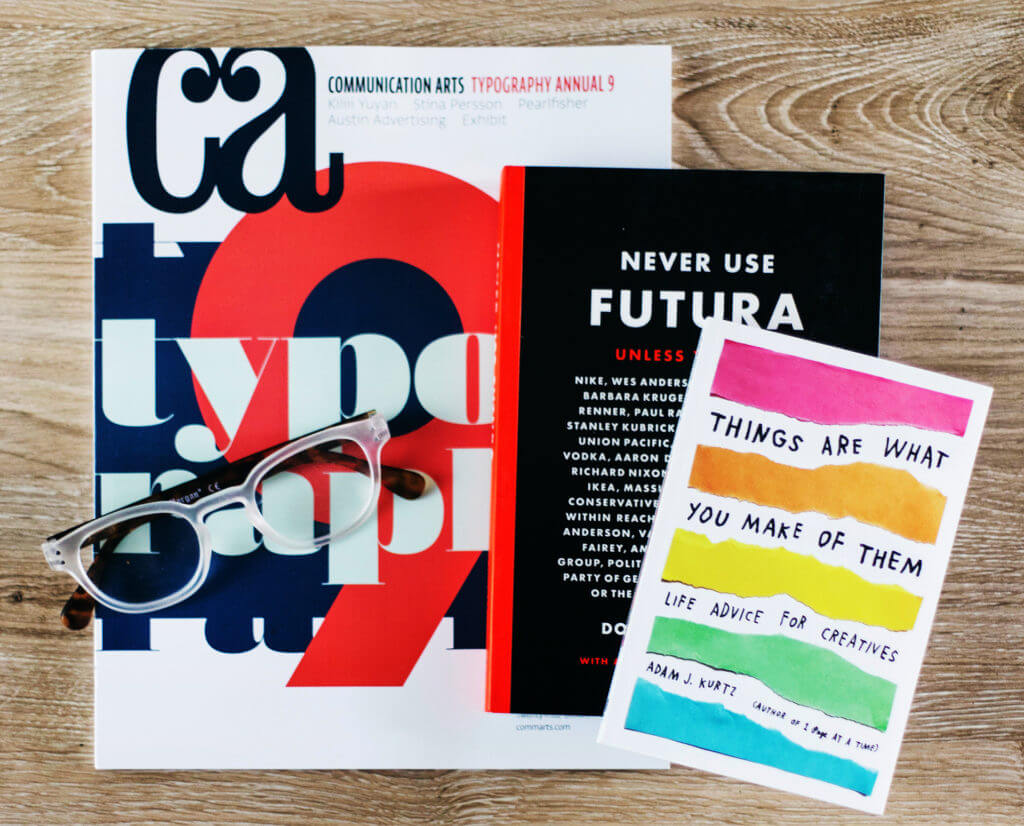 Stack of three graphic design books for artists