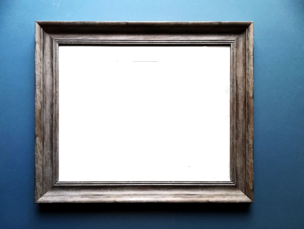 Empty, weathered wooden picture frame on a blue background