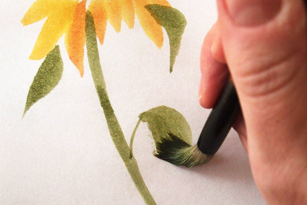 Photo showing how to paint sunflower leaves with a Chinese brush and watercolor paint