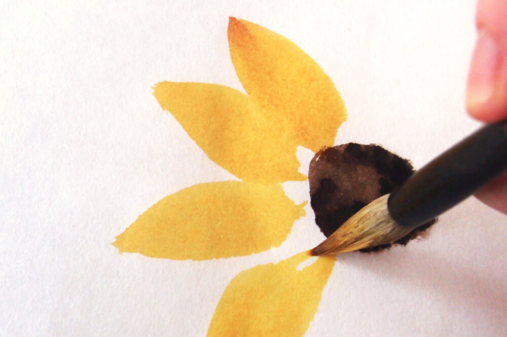 A Chinese brush painting a sunflower petal