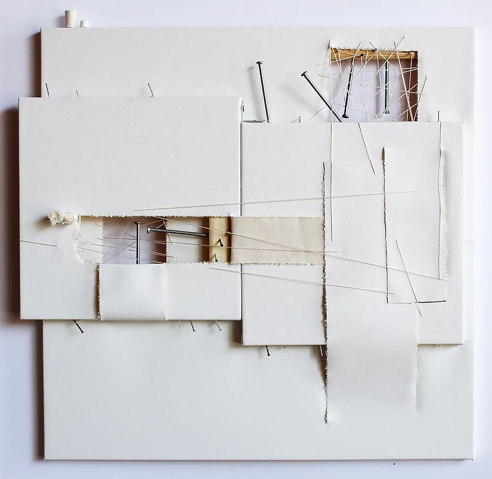 Artwork made of deconstructed canvas, with thread and nails
