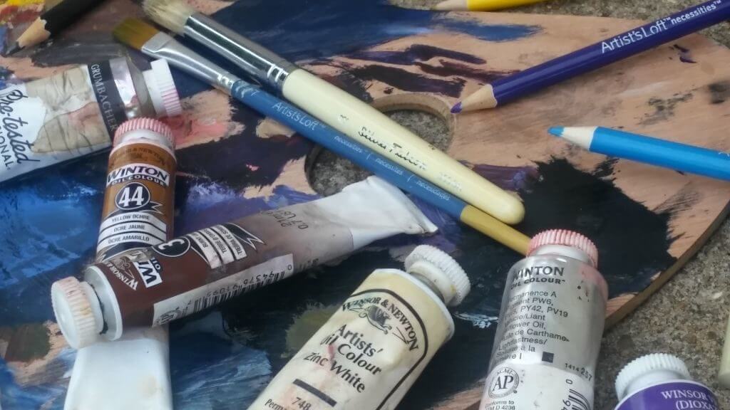 Oil painting supplies: brushes, paint, palette