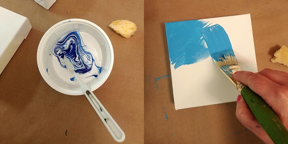 mixing gesso and blue to paint a light blue canvas