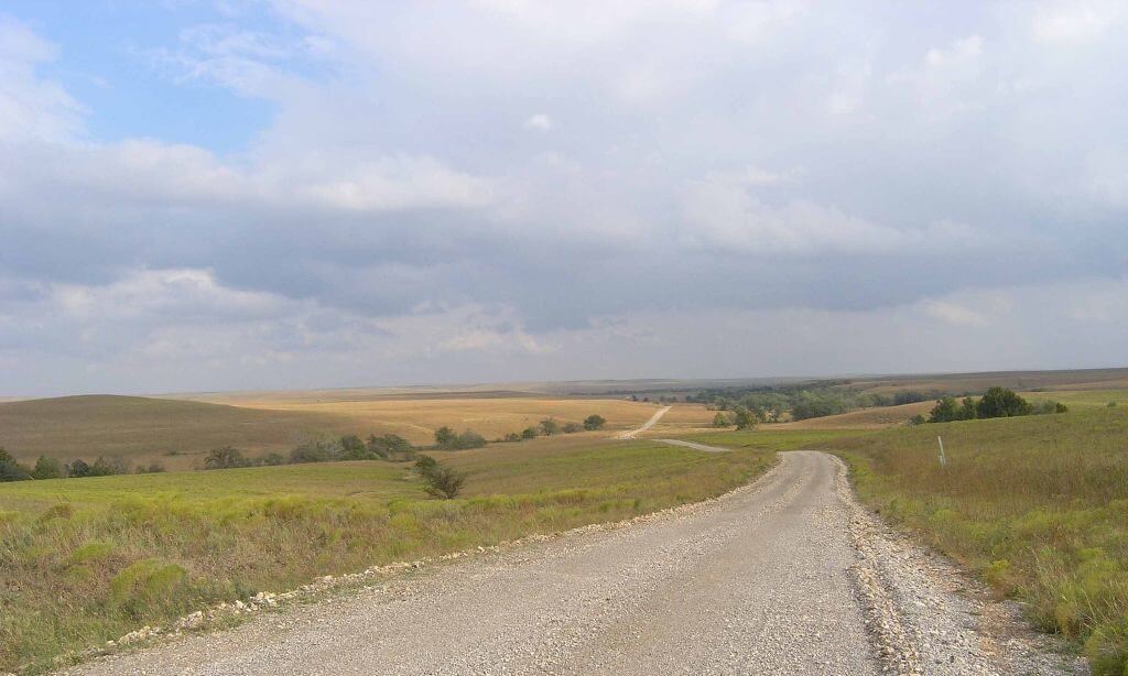 An inspiration photograph of a road leading into the Flint Hills